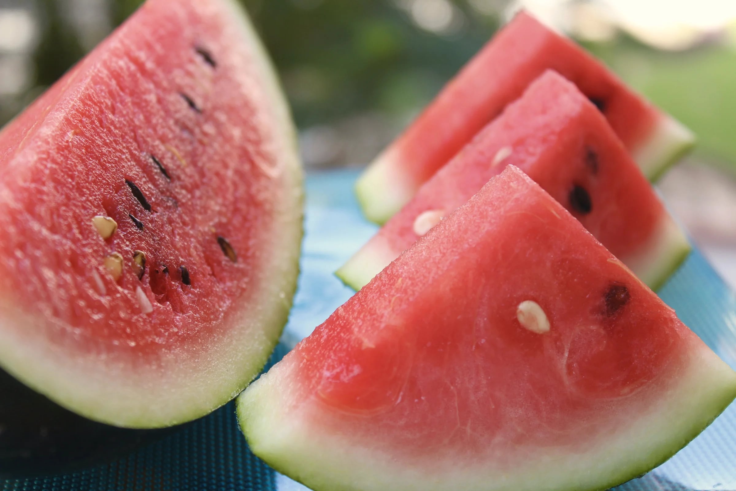 Wedges of watermelon on a blue cloth